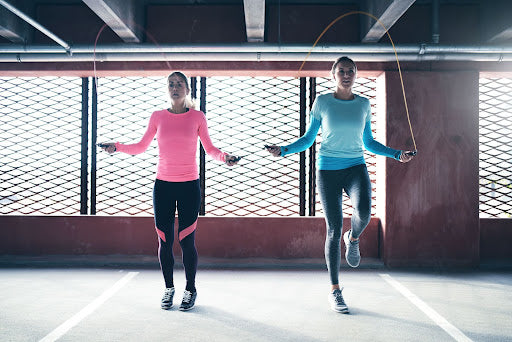 2 women jump roping